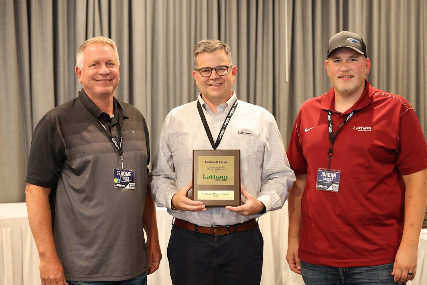 Jerome and Jordan Stoesz receive an award for 35 years of service with Latham